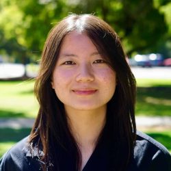 Melody Luo smiling outdoors at SuperTech FT, showcasing her involvement in technology and innovation.