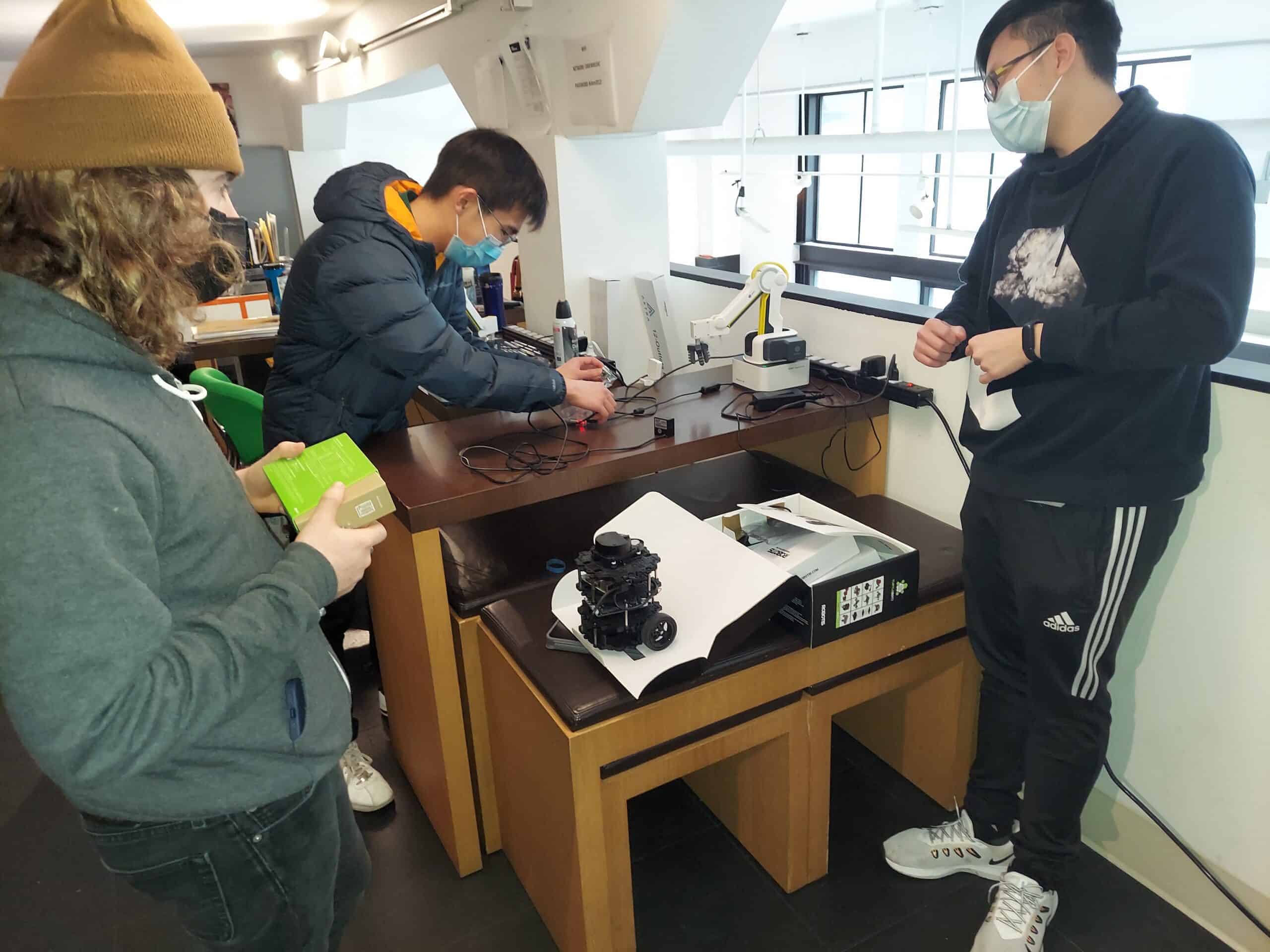 Nick, Adam, and Ender working on Dobot